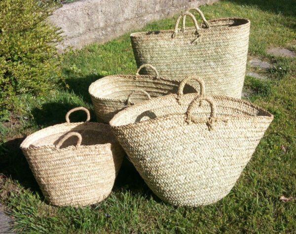 Photo des différentes tailles de panier à linge réalisé en fibre naturelle de palmier.